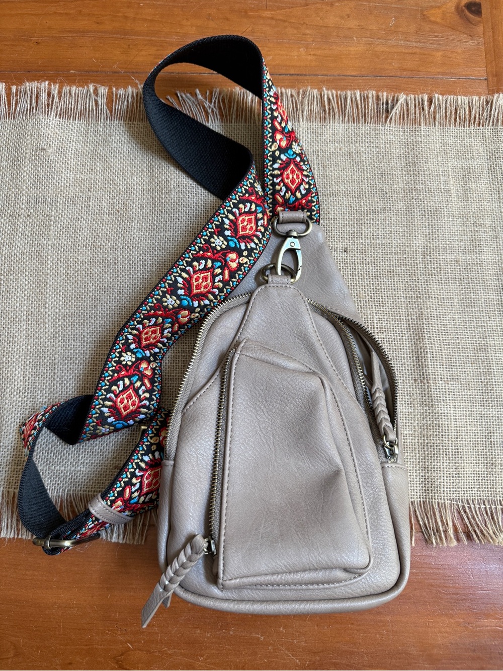 Tan cross body bag with decorative strap